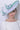 Woman wearing Nigel Rayment Hatinator - Style 39 - Ivory/Emerald, suitable for weddings and special occasions